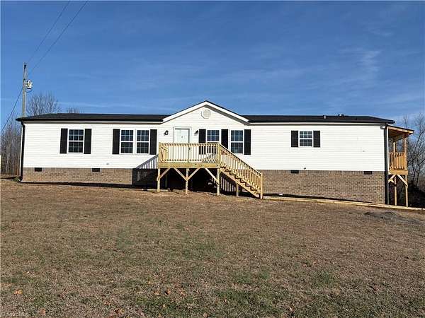 6 Acres of Land with Home for Sale in Staley, North Carolina