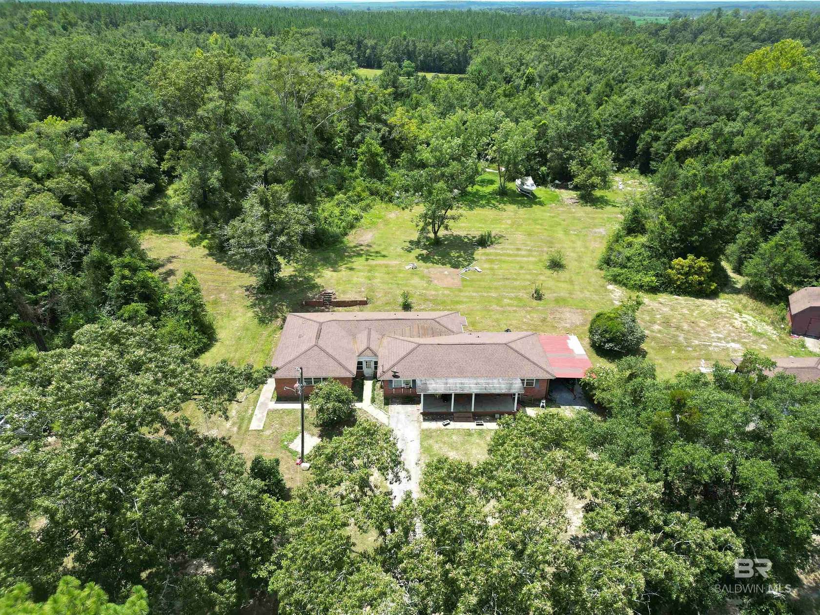 5.69 Acres of Land with Home for Sale in Molino, Florida