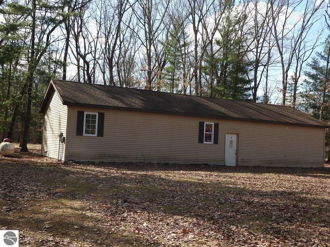5 Acres of Land with Home for Sale in Irons, Michigan