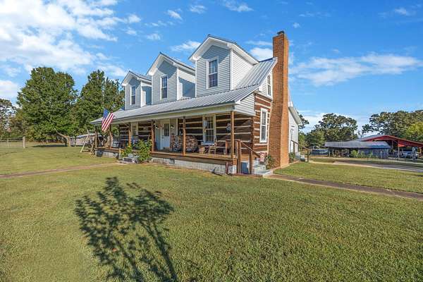 6.69 Acres of Land with Home for Sale in Buena Vista, Tennessee