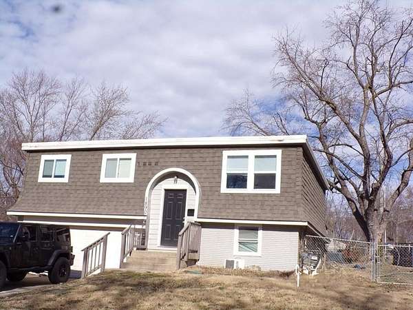 19 Acres of Land with Home for Auction in Independence, Missouri