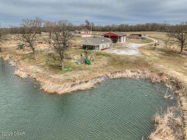83 Acres of Recreational Land with Home for Sale in Lamar, Missouri