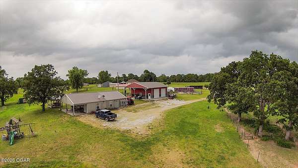 83 Acres of Recreational Land with Home for Sale in Lamar, Missouri