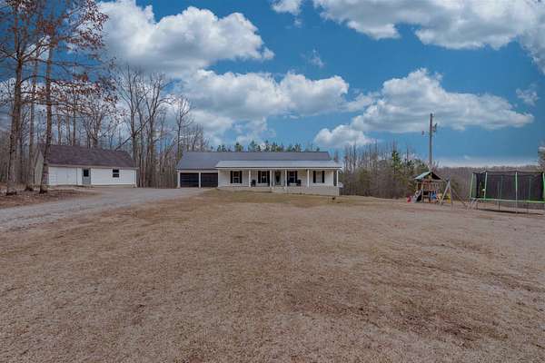 11.6 Acres of Recreational Land with Home for Sale in Cypress Inn, Tennessee