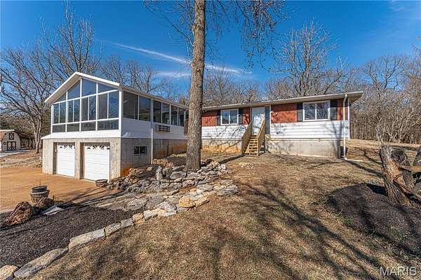 7.56 Acres of Land with Home for Sale in De Soto, Missouri