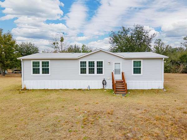 9.12 Acres of Land with Home for Sale in Live Oak, Florida