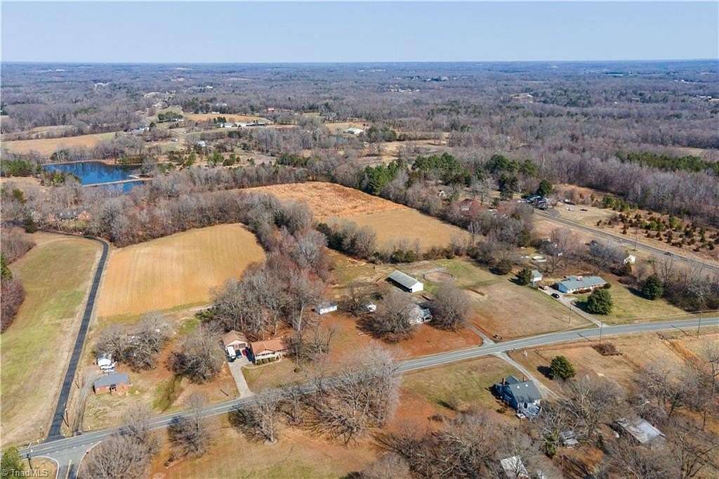 11.2 Acres of Land with Home for Sale in Gibsonville, North Carolina