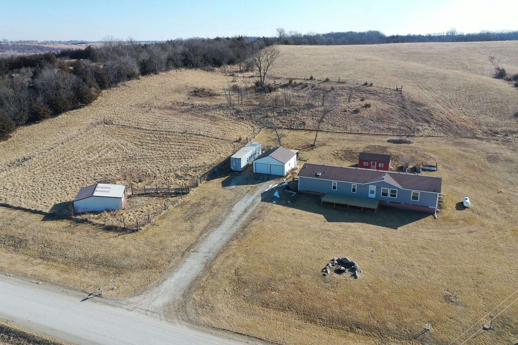 10 Acres of Recreational Land with Home for Sale in Lacona, Iowa