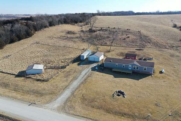 10 Acres of Recreational Land with Home for Sale in Lacona, Iowa