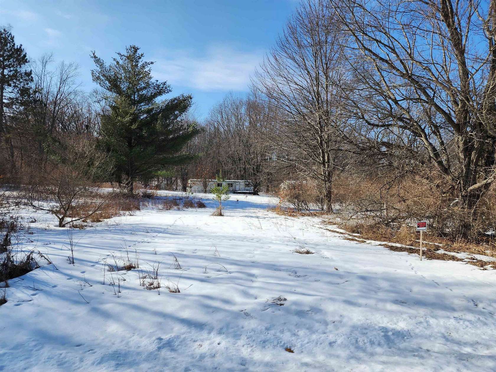 10 Acres of Recreational Land with Home for Sale in Harrison, Michigan