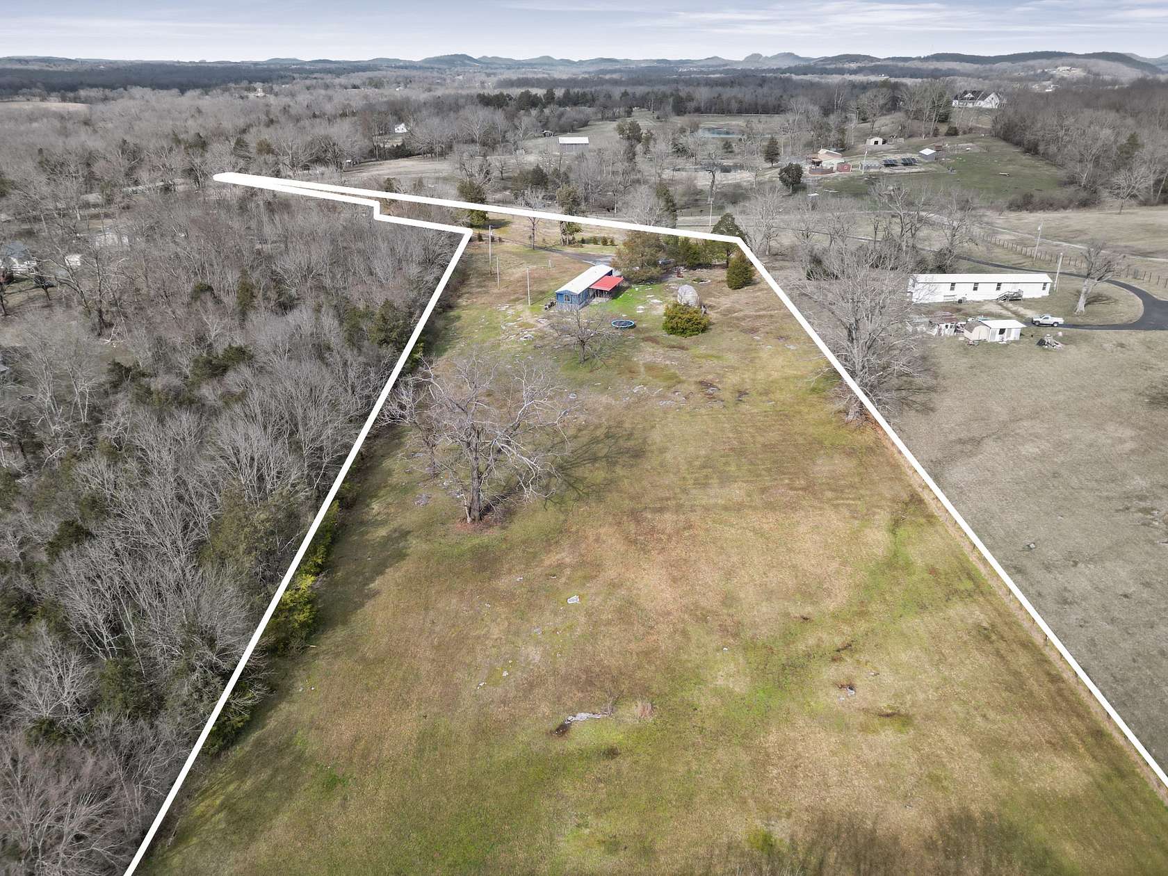 5.68 Acres of Land with Home for Sale in Castalian Springs, Tennessee