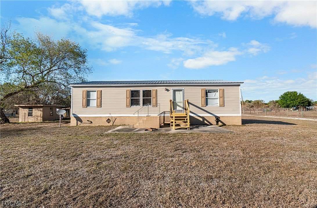 1.86 Acres of Land with Home for Sale in Fort Denaud, Florida