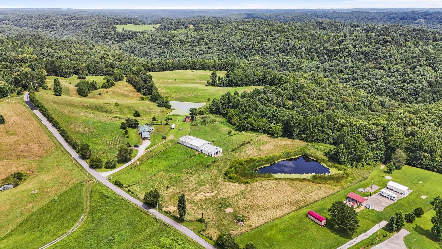 80 Acres of Agricultural Land with Home for Sale in Zoe, Kentucky