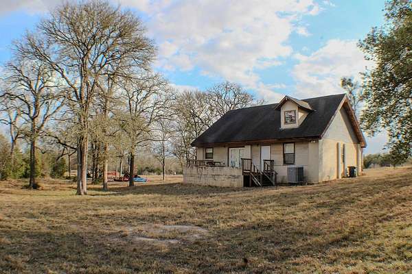 121 Acres of Land with Home for Sale in Bastrop, Texas
