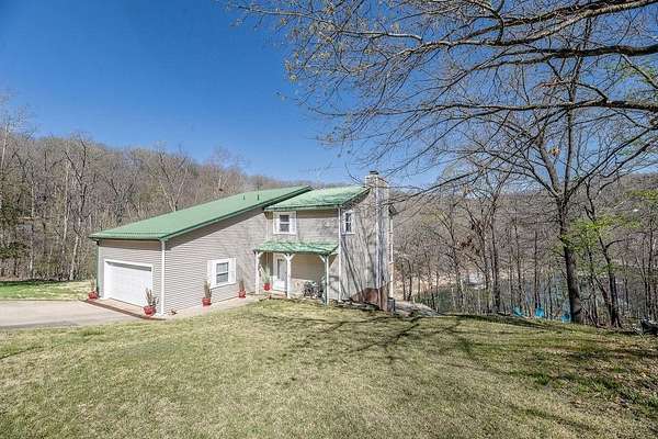 1.62 Acres of Land with Home for Sale in Garfield, Arkansas