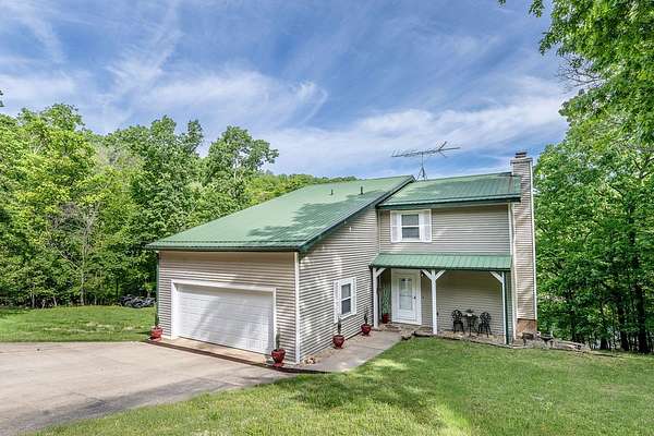 1.62 Acres of Land with Home for Sale in Garfield, Arkansas