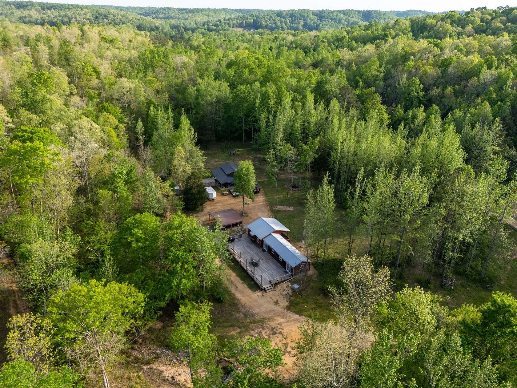 46.7 Acres of Recreational Land with Home for Sale in Lobelville, Tennessee