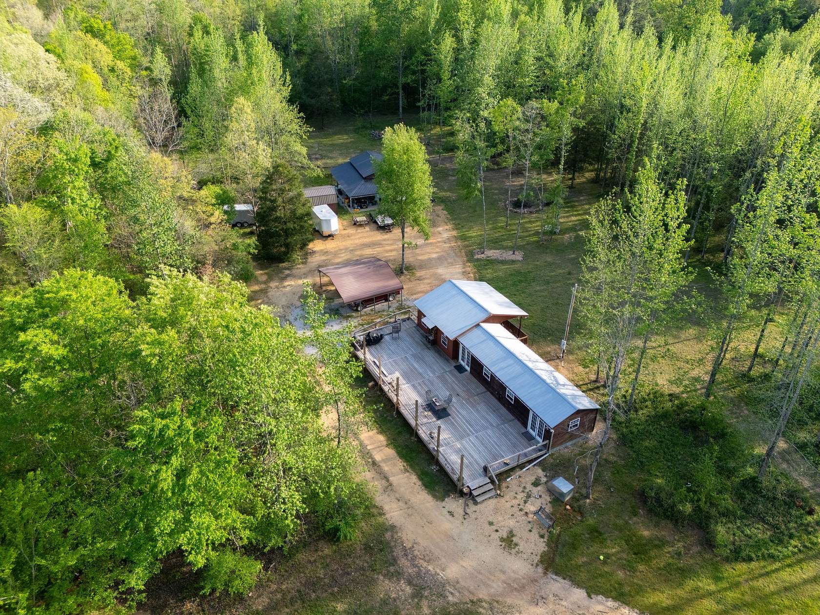 46.7 Acres of Recreational Land with Home for Sale in Lobelville, Tennessee