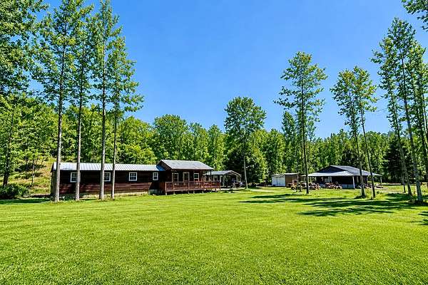 46.7 Acres of Recreational Land with Home for Sale in Lobelville, Tennessee