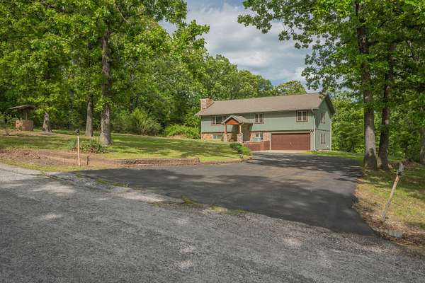 11 Acres of Recreational Land with Home for Sale in Neosho, Missouri