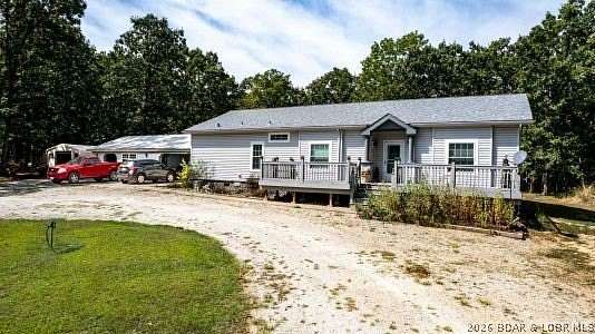 10.5 Acres of Land with Home for Sale in Stover, Missouri