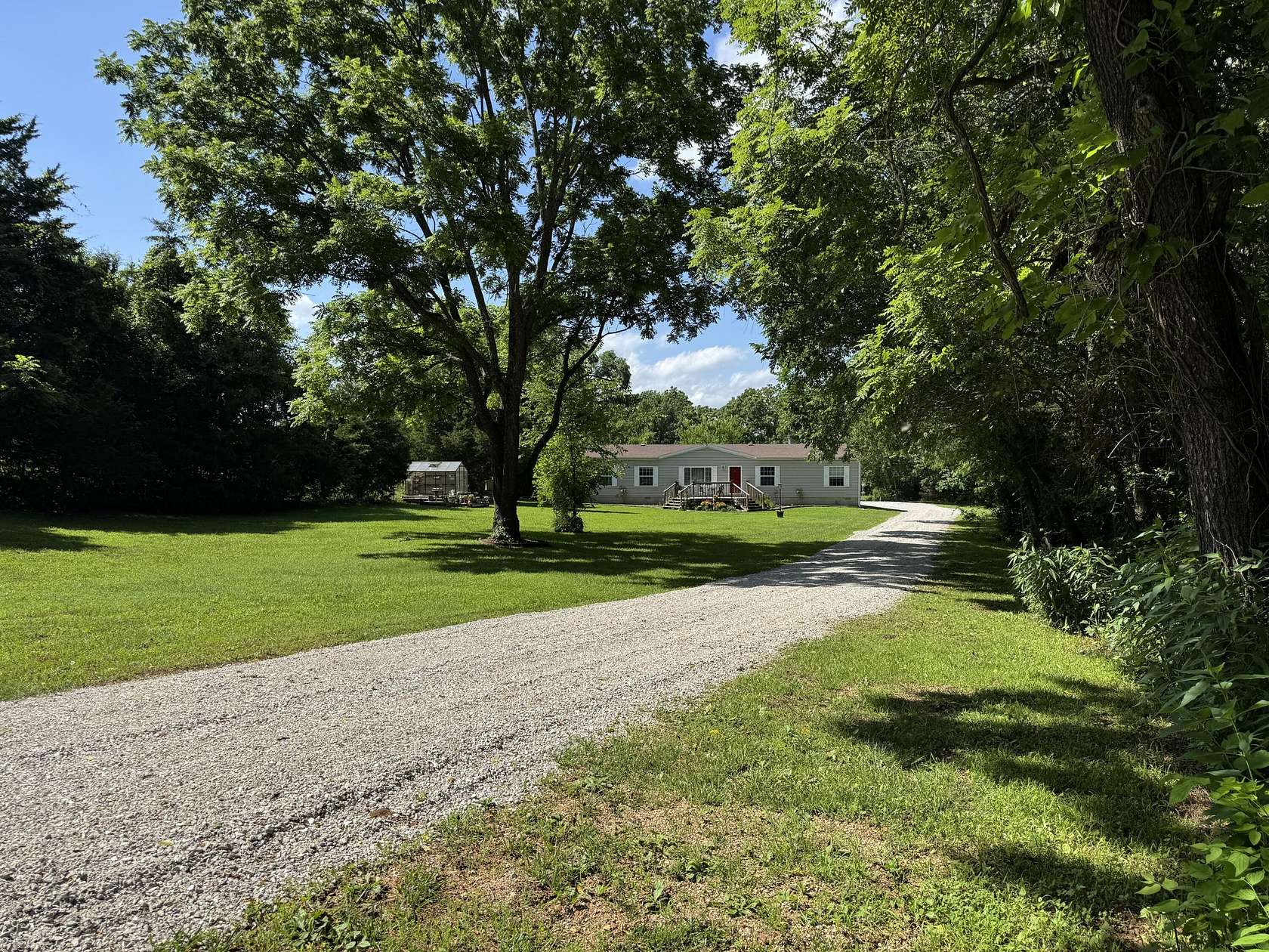 5 Acres of Land with Home for Sale in Humansville, Missouri