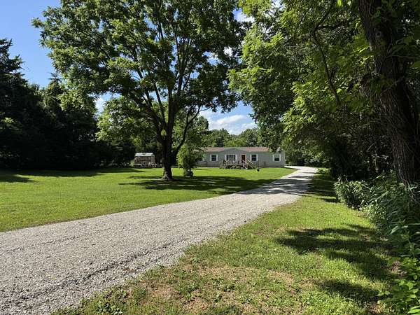 5 Acres of Land with Home for Sale in Humansville, Missouri