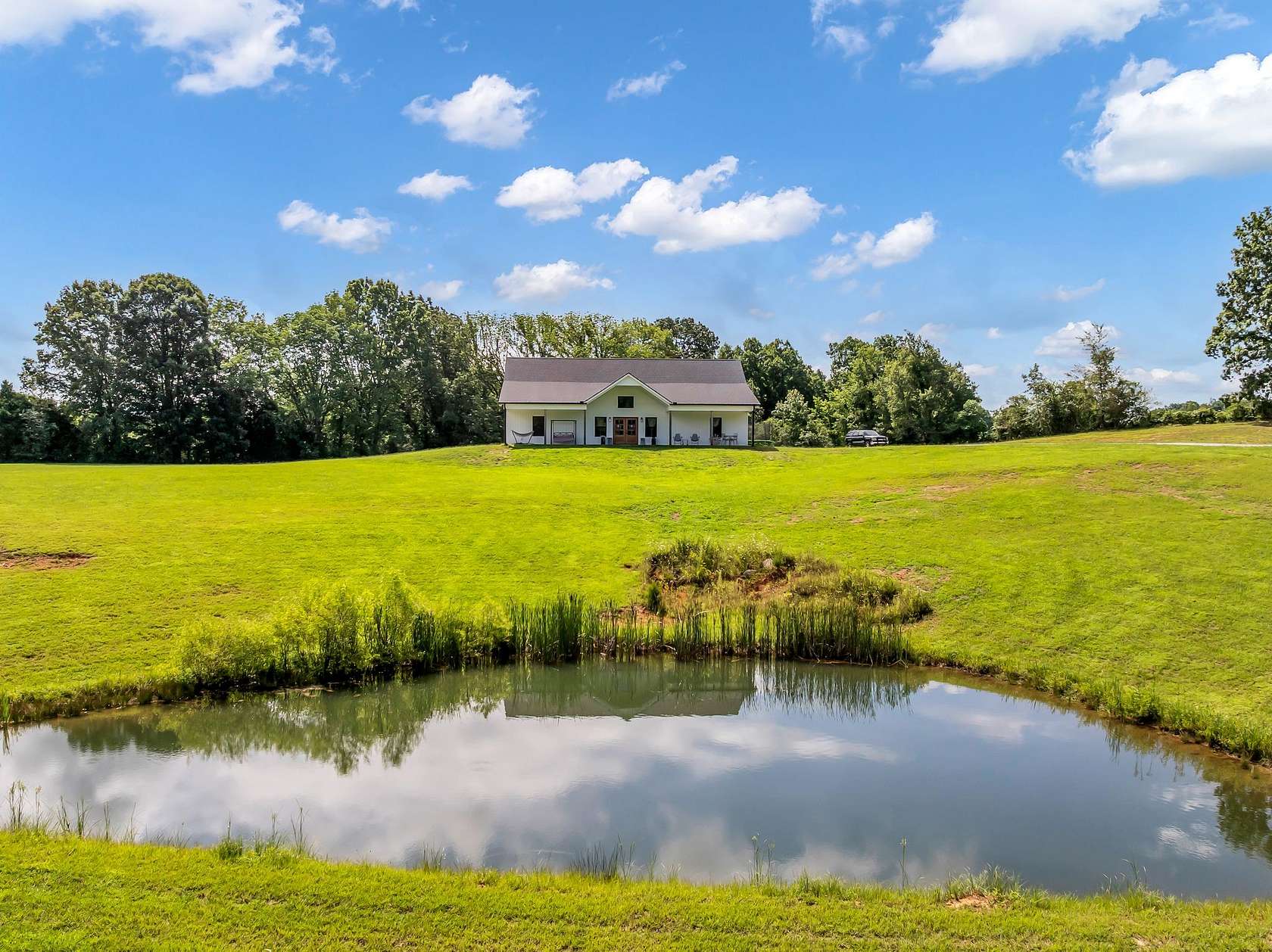 8.12 Acres of Land with Home for Sale in Burns, Tennessee