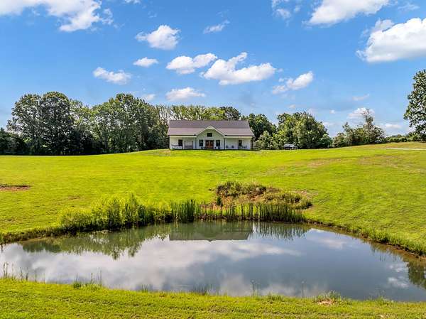 8.12 Acres of Land with Home for Sale in Burns, Tennessee