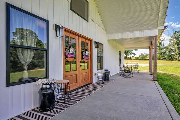 8.12 Acres of Land with Home for Sale in Burns, Tennessee