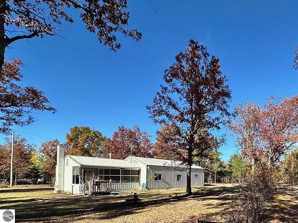10 Acres of Recreational Land with Home for Sale in Fife Lake, Michigan