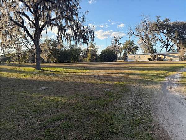 5.49 Acres of Land with Home for Sale in Newberry, Florida