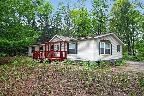 6.6 Acres of Land with Home for Sale in Scottville, Michigan