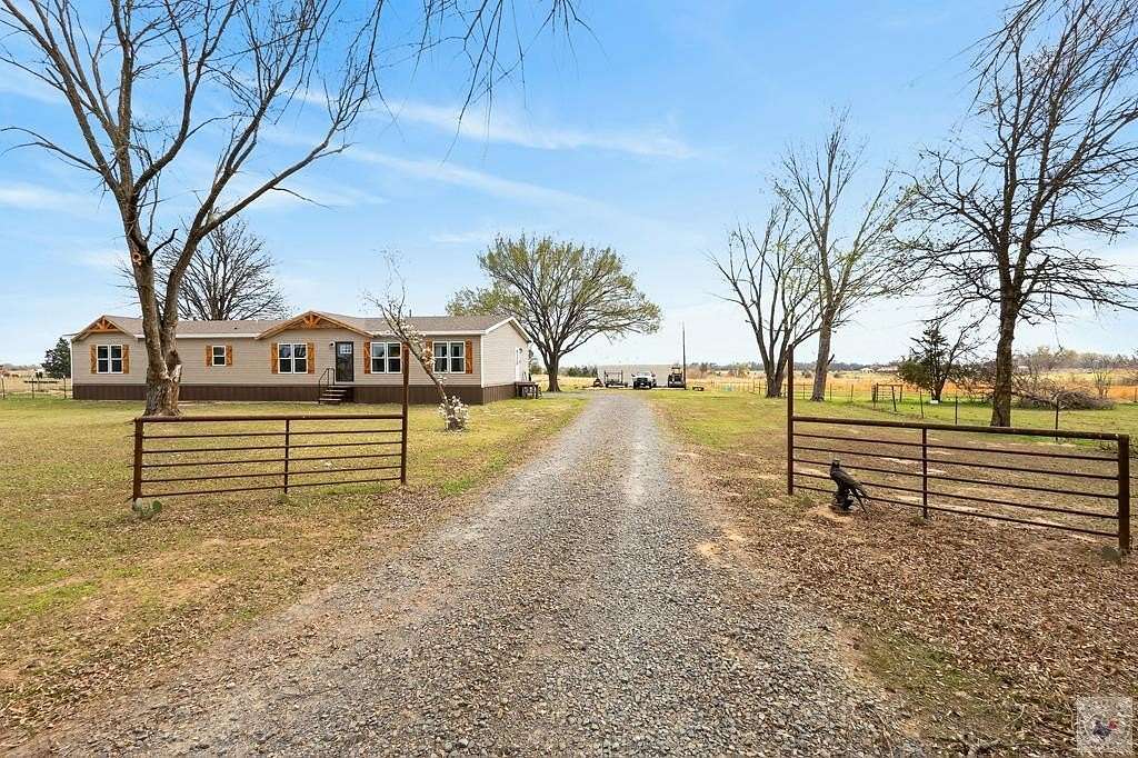 14.9 Acres of Land with Home for Sale in De Kalb, Texas