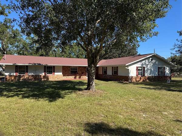 3.79 Acres of Land with Home for Sale in Hudson, Florida