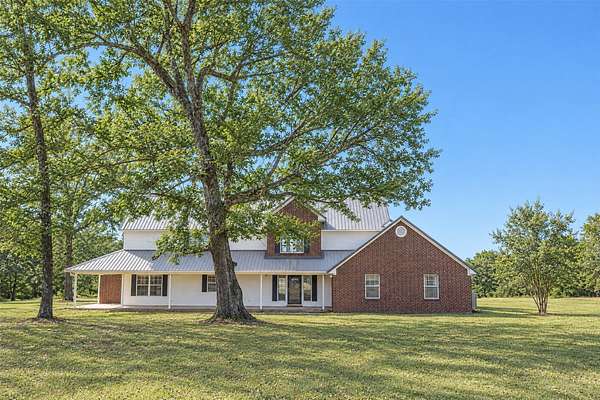 9.64 Acres of Land with Home for Sale in New Boston, Texas