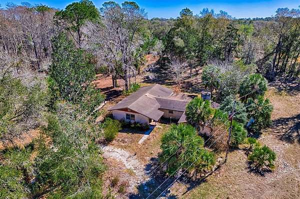 4.66 Acres of Land with Home for Sale in Bronson, Florida