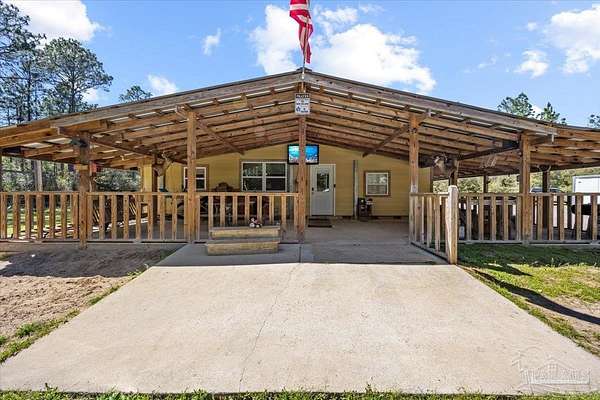 1.5 Acres of Land with Home for Sale in Milton, Florida