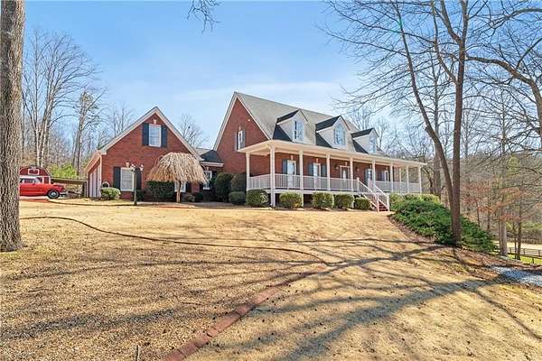 5.7 Acres of Land with Home for Sale in Ball Ground, Georgia