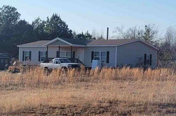1.64 Acres of Land with Home for Auction in Alpine, Alabama