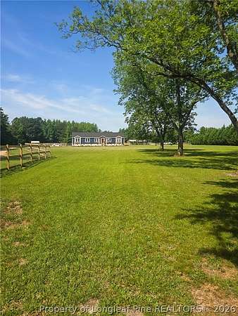 5.66 Acres of Land with Home for Sale in St. Pauls, North Carolina