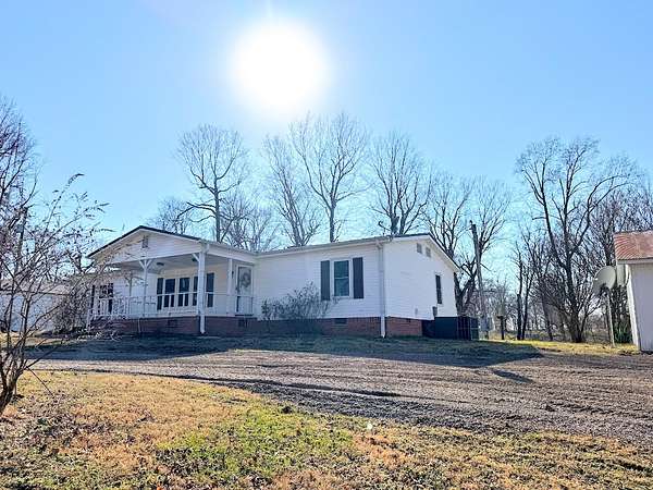 1.5 Acres of Land with Home for Sale in Adams, Tennessee