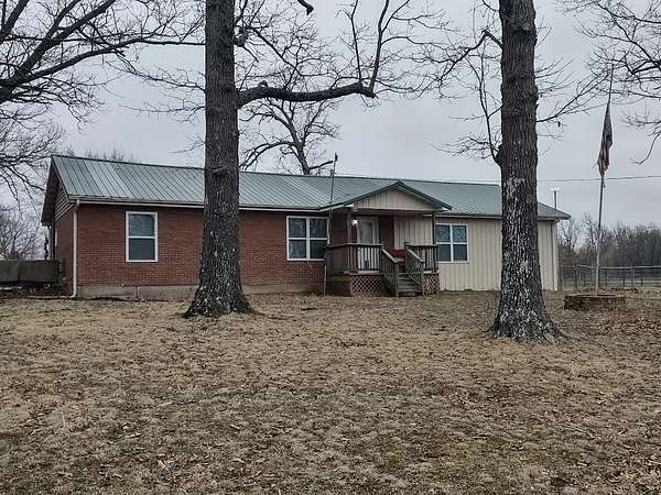36 Acres of Land with Home for Sale in Niangua, Missouri