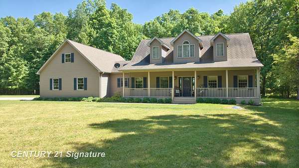11.4 Acres of Land with Home for Auction in Chesaning, Michigan