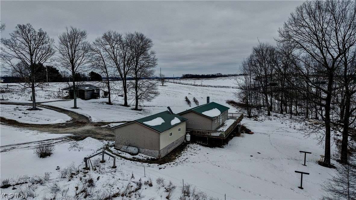 11.5 Acres of Land with Home for Auction in Carrollton, Ohio