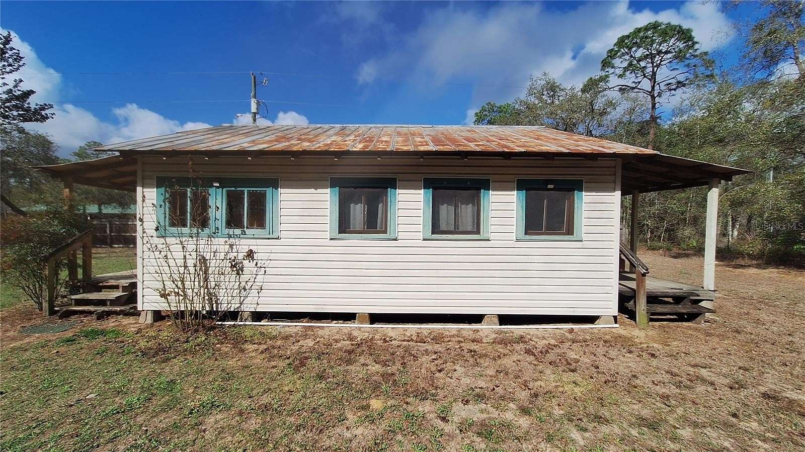 0.5 Acres of Land with Home for Sale in Fort McCoy, Florida