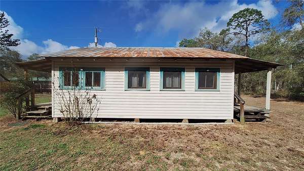 0.5 Acres of Land with Home for Sale in Fort McCoy, Florida