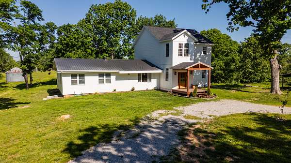 83 Acres of Agricultural Land with Home for Sale in Rueter, Missouri