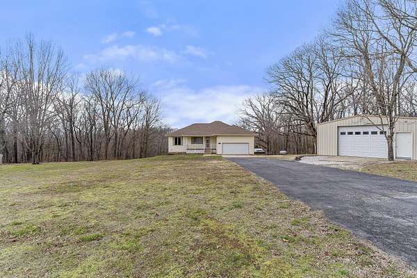 6.69 Acres of Land with Home for Sale in Clever, Missouri