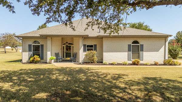 6.6 Acres of Land with Home for Sale in Adamsville, Tennessee